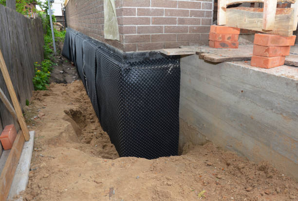 SJ Waterproofing Pros technician performing targeted Basement Waterproofing assessment in Batesville, IN